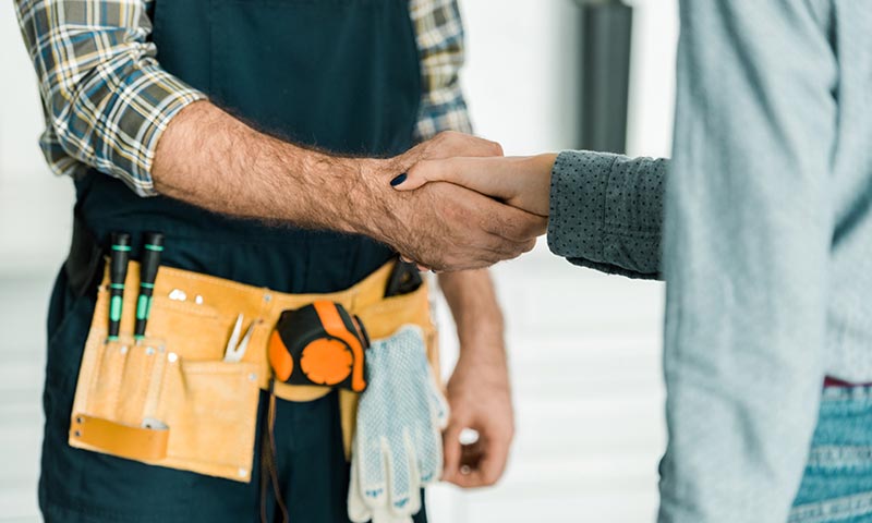 Technician and Customer shaking hands